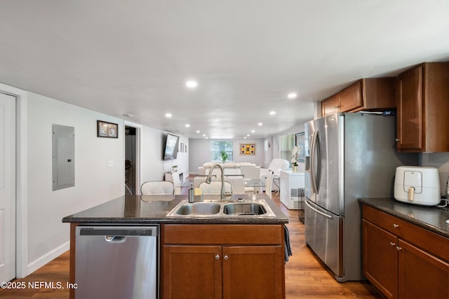 2780 Paul Ave, Jacksonville, FL 32207 - kitchen featuring appliances with stainless steel finishes, a sink, a kitchen island with sink, electric panel, and open floor plan