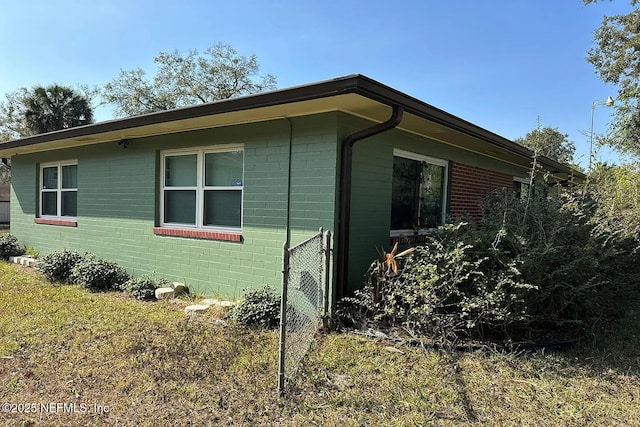 3446 NE 11th St, Ocala, FL 34470 - view of side of property featuring concrete block siding