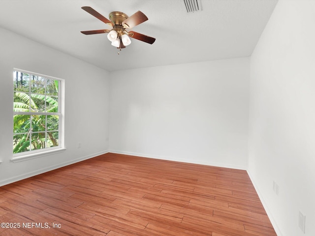 96092 Piney Island Dr, Fernandina Beach, FL 32034 - spare room featuring a ceiling fan, baseboards, and light wood finished floors