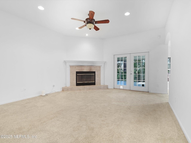 96092 Piney Island Dr, Fernandina Beach, FL 32034 - unfurnished living room with carpet, french doors, ceiling fan, recessed lighting, and a fireplace