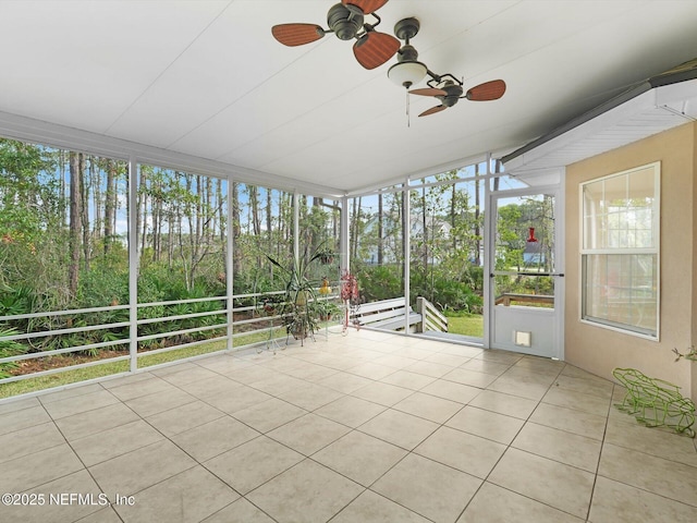 96092 Piney Island Dr, Fernandina Beach, FL 32034 - unfurnished sunroom featuring ceiling fan and view of scattered trees