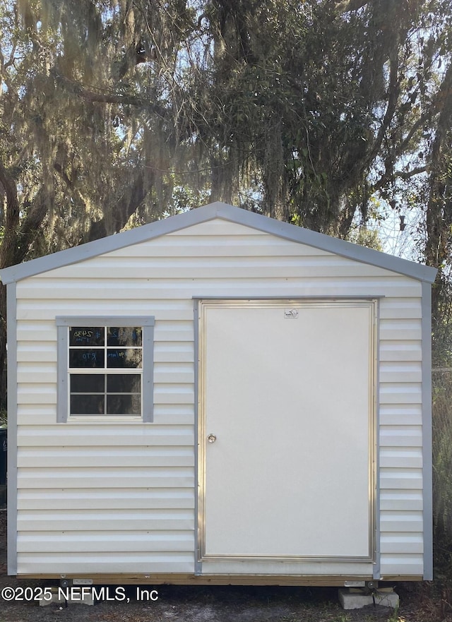 5466 Leonard St, Fernandina Beach, FL 32034 - garage featuring a storage shed