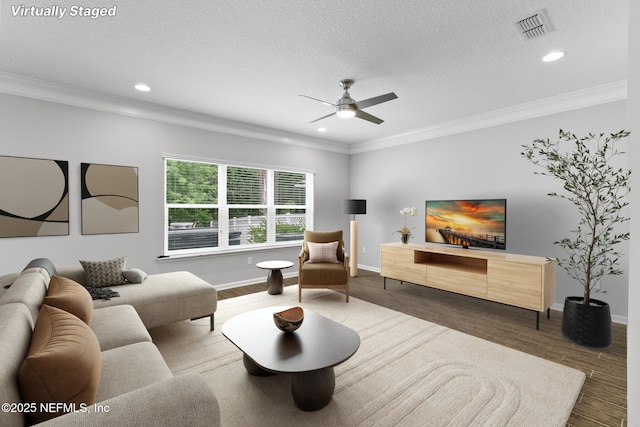 356 Heron Landing Rd, Saint Johns, FL 32259 - living room with a ceiling fan, recessed lighting, baseboards, wood finished floors, and crown molding