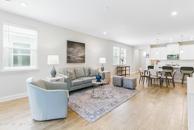 109 Fly Line Dr, Saint Johns, FL 32259 - living area with light wood-style flooring, baseboards, and recessed lighting