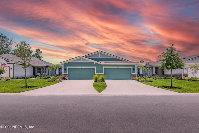 109 Fly Line Dr, Saint Johns, FL 32259 - ranch-style house featuring a front lawn, stone siding, concrete driveway, and a garage
