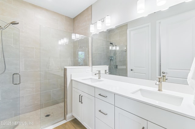 109 Fly Line Dr, Saint Johns, FL 32259 - bathroom with a shower stall, double vanity, and wood finished floors