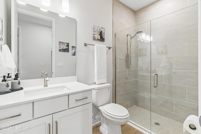 109 Fly Line Dr, Saint Johns, FL 32259 - bathroom with toilet, vanity, a shower stall, and wood finished floors