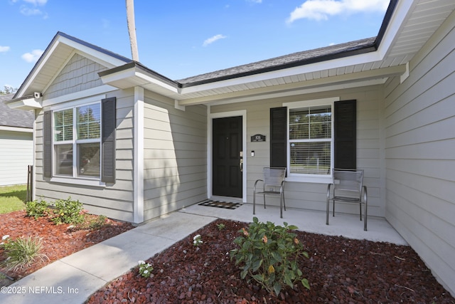 836 Cove St, Green Cove Springs, FL 32043 - doorway to property featuring covered porch