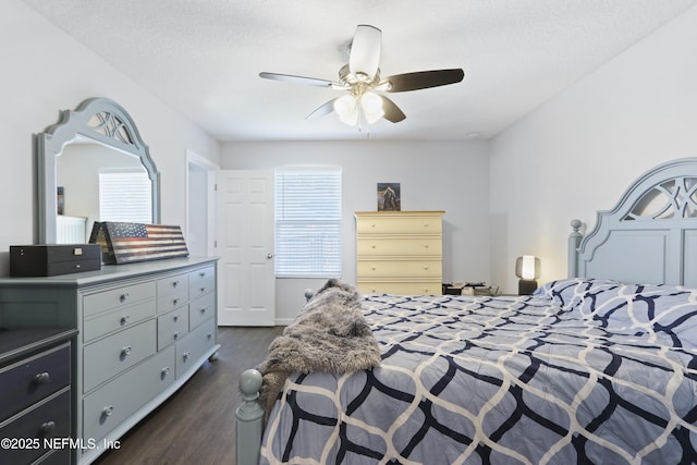 836 Cove St, Green Cove Springs, FL 32043 - bedroom with dark wood-type flooring, a ceiling fan, and a textured ceiling