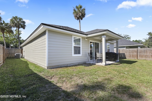 836 Cove St, Green Cove Springs, FL 32043 - back of property with central AC unit and a patio area