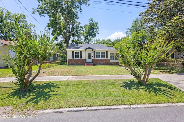 606 Meteor St, Jacksonville, FL 32205 - ranch-style house with a front yard, brick siding, and entry steps