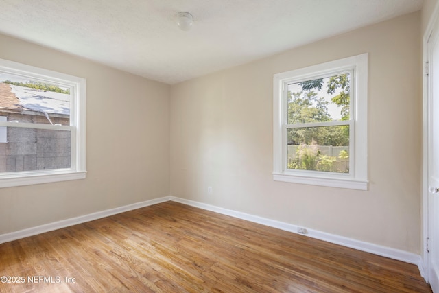606 Meteor St, Jacksonville, FL 32205 - spare room featuring plenty of natural light, light wood-style floors, and baseboards