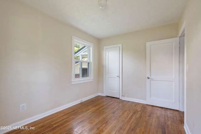606 Meteor St, Jacksonville, FL 32205 - unfurnished bedroom featuring baseboards and wood finished floors