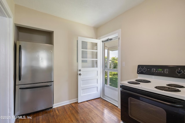 606 Meteor St, Jacksonville, FL 32205 - kitchen featuring electric range, freestanding refrigerator, wood finished floors, and baseboards
