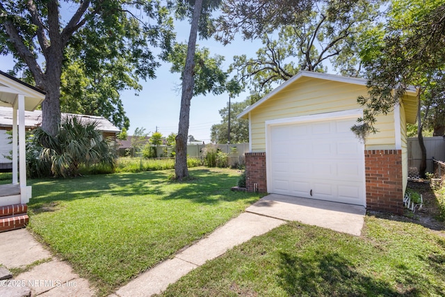 606 Meteor St, Jacksonville, FL 32205 - view of yard with concrete driveway, an outdoor structure, and a garage