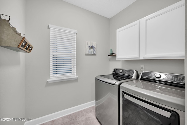 91 Rockhurst Trl, Jacksonville, FL 32081 - laundry room with cabinet space, washer and dryer, baseboards, and light tile patterned floors