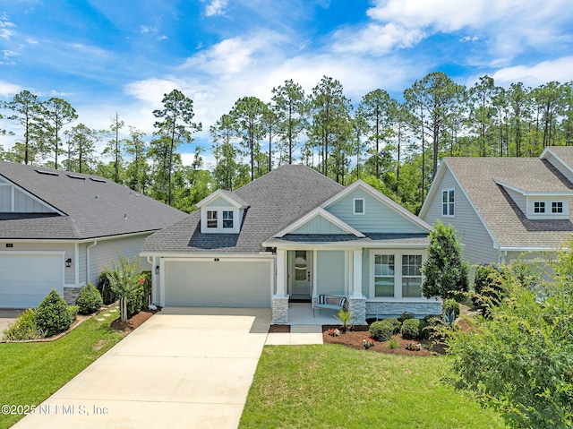 91 Rockhurst Trl, Jacksonville, FL 32081 - craftsman house featuring stone siding, a front yard, an attached garage, and concrete driveway
