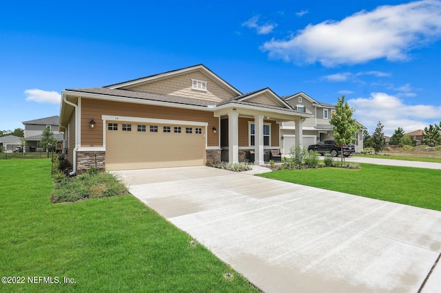 54 Pepperpike Way, Saint Augustine, FL 32092 - craftsman inspired home with stone siding, a garage, driveway, a front yard, and a porch