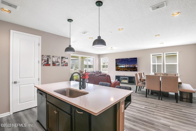 54 Pepperpike Way, Saint Augustine, FL 32092 - kitchen with a sink, light wood-type flooring, dishwasher, light countertops, and healthy amount of natural light