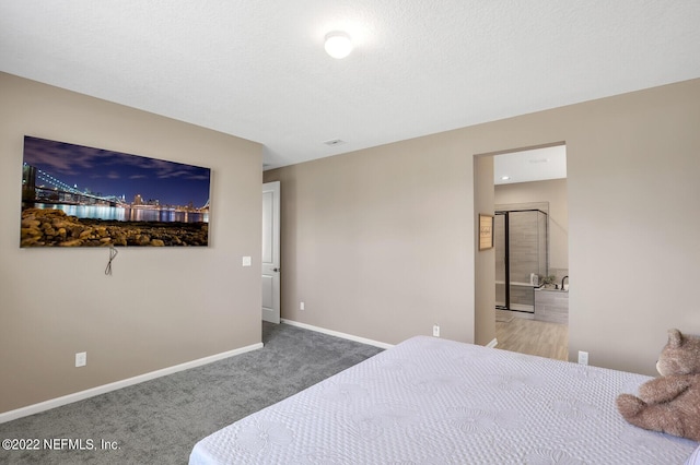 54 Pepperpike Way, Saint Augustine, FL 32092 - bedroom with carpet flooring, baseboards, and connected bathroom