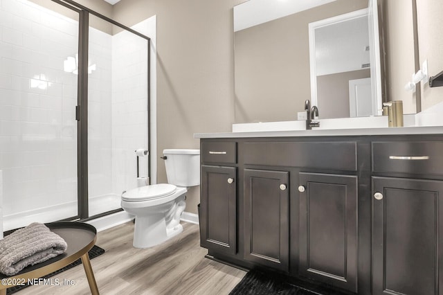 54 Pepperpike Way, Saint Augustine, FL 32092 - bathroom featuring toilet, a shower stall, vanity, wood finished floors, and baseboards