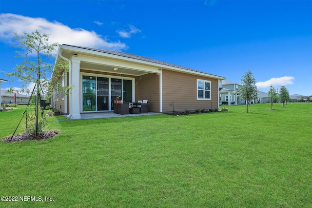54 Pepperpike Way, Saint Augustine, FL 32092 - rear view of property with a patio, a yard, and an outdoor living space