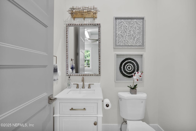2790 Joe Ashton Rd, Saint Augustine, FL 32092 - half bathroom with toilet, vanity, and baseboards