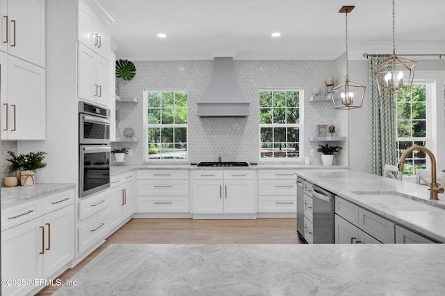2790 Joe Ashton Rd, Saint Augustine, FL 32092 - kitchen featuring crown molding, open shelves, a sink, custom exhaust hood, and a chandelier