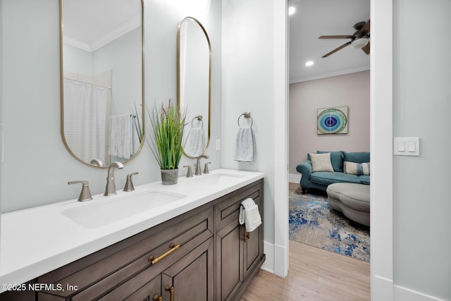 2790 Joe Ashton Rd, Saint Augustine, FL 32092 - full bathroom featuring crown molding, wood finished floors, double vanity, a ceiling fan, and recessed lighting