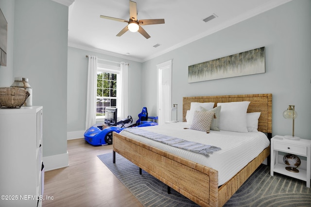 2790 Joe Ashton Rd, Saint Augustine, FL 32092 - bedroom featuring wood finished floors, ornamental molding, baseboards, and a ceiling fan
