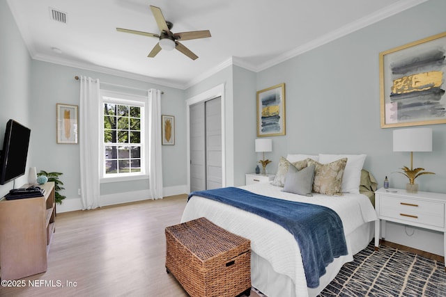 2790 Joe Ashton Rd, Saint Augustine, FL 32092 - bedroom featuring wood finished floors, baseboards, ornamental molding, a closet, and ceiling fan