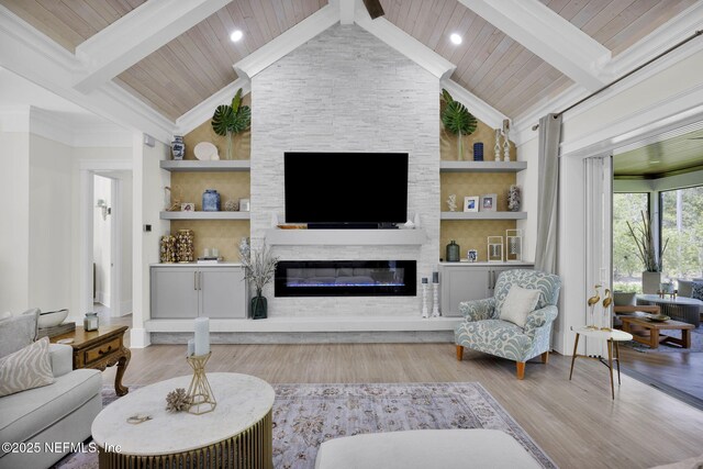2790 Joe Ashton Rd, Saint Augustine, FL 32092 - living area featuring wood finished floors, a fireplace, wooden ceiling, built in shelves, and crown molding