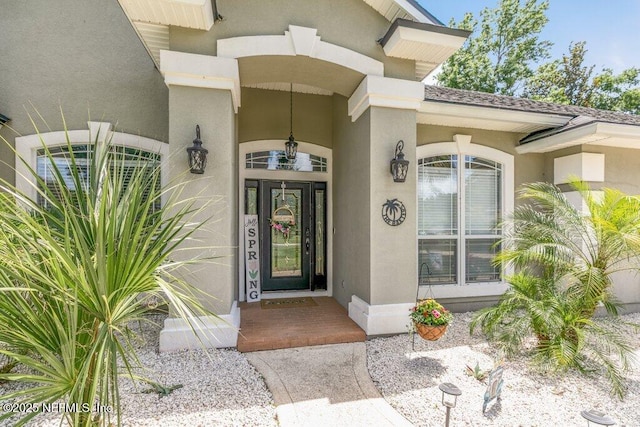 2918 Grande Oaks Way, Fleming Island, FL 32003 - view of exterior entry with stucco siding