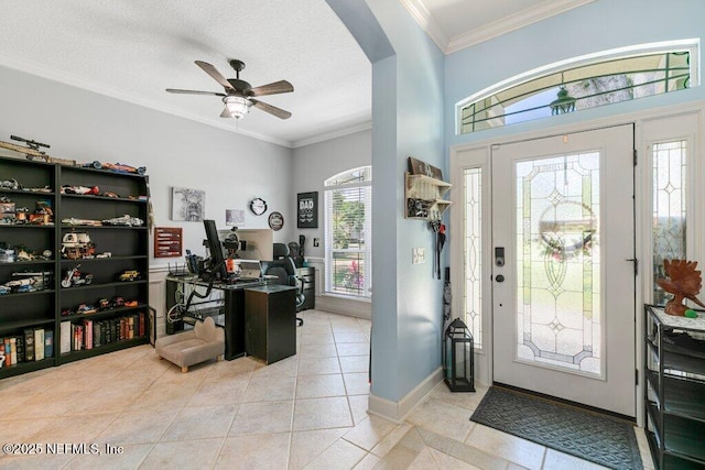 2918 Grande Oaks Way, Fleming Island, FL 32003 - entrance foyer featuring light tile patterned floors, arched walkways, ceiling fan, and crown molding