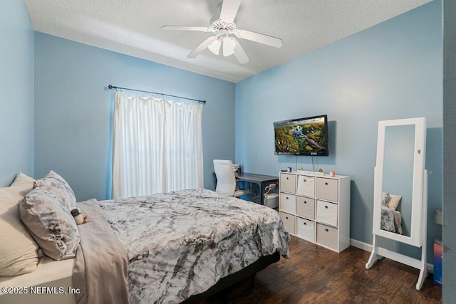 2918 Grande Oaks Way, Fleming Island, FL 32003 - bedroom featuring wood finished floors, a textured ceiling, ceiling fan, and baseboards