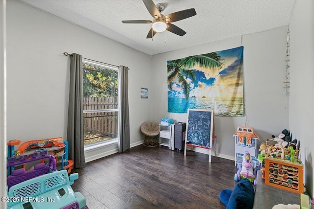 2918 Grande Oaks Way, Fleming Island, FL 32003 - game room with a ceiling fan, wood finished floors, a textured ceiling, and baseboards