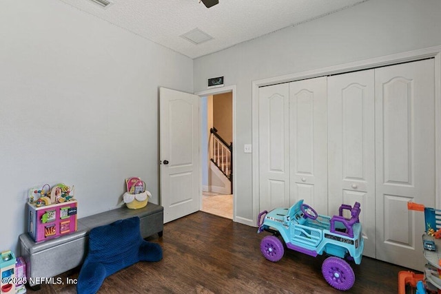 2918 Grande Oaks Way, Fleming Island, FL 32003 - playroom featuring wood finished floors and a textured ceiling