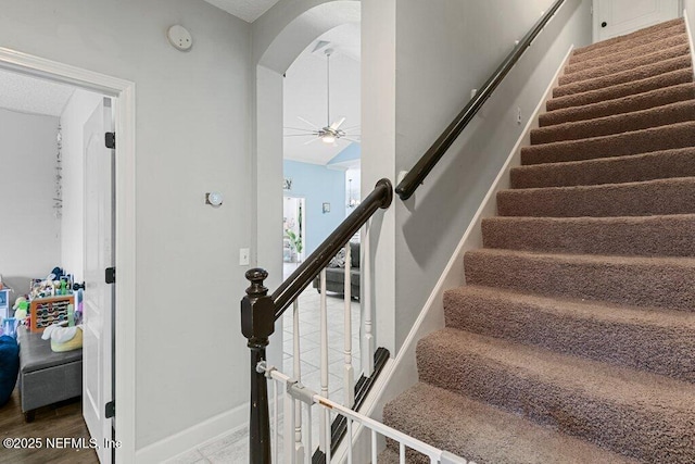 2918 Grande Oaks Way, Fleming Island, FL 32003 - stairs featuring arched walkways, baseboards, and a ceiling fan