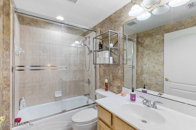 2918 Grande Oaks Way, Fleming Island, FL 32003 - full bathroom featuring toilet, a textured ceiling, vanity, and combined bath / shower with glass door