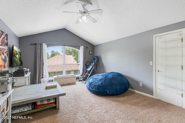 2918 Grande Oaks Way, Fleming Island, FL 32003 - rec room featuring carpet, a textured ceiling, lofted ceiling, a ceiling fan, and baseboards