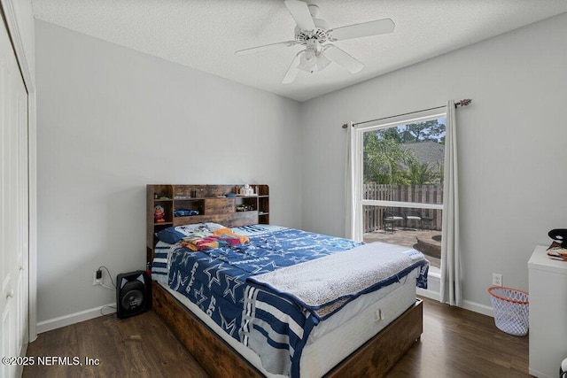 2918 Grande Oaks Way, Fleming Island, FL 32003 - bedroom with wood finished floors, baseboards, a ceiling fan, and a textured ceiling