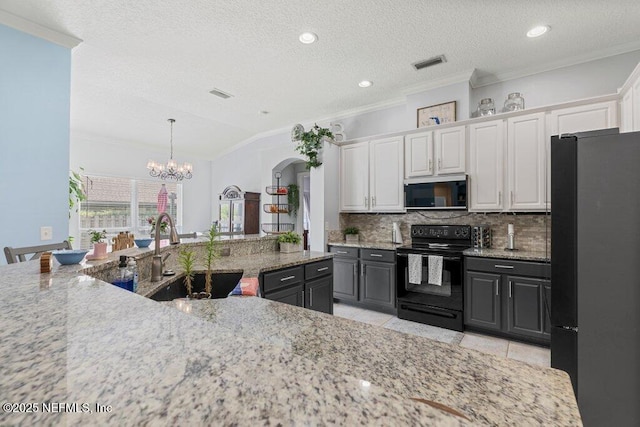 2918 Grande Oaks Way, Fleming Island, FL 32003 - kitchen with black appliances, a sink, crown molding, white cabinetry, and backsplash