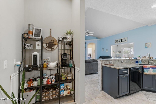 2918 Grande Oaks Way, Fleming Island, FL 32003 - kitchen featuring black dishwasher, vaulted ceiling, a sink, arched walkways, and light tile patterned floors