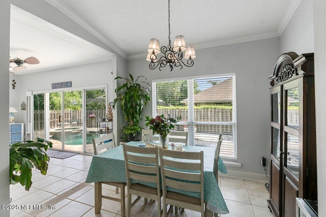 2918 Grande Oaks Way, Fleming Island, FL 32003 - dining area with a chandelier, light tile patterned floors, a textured ceiling, a ceiling fan, and crown molding