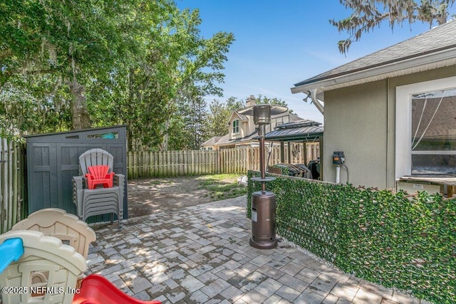 2918 Grande Oaks Way, Fleming Island, FL 32003 - fenced backyard featuring a gazebo and a patio area