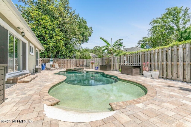 2918 Grande Oaks Way, Fleming Island, FL 32003 - view of pool featuring a patio, a fenced backyard, and a pool with connected hot tub