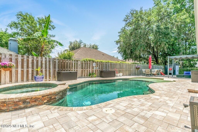 2918 Grande Oaks Way, Fleming Island, FL 32003 - view of pool with a patio, a fenced backyard, a pool with connected hot tub, and central air condition unit