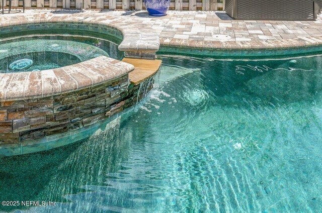 2918 Grande Oaks Way, Fleming Island, FL 32003 - view of swimming pool with a pool with connected hot tub