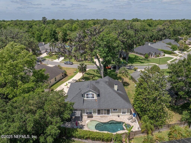 2918 Grande Oaks Way, Fleming Island, FL 32003 - view of property location featuring a pool area, nearby suburban area, and a heavily wooded area