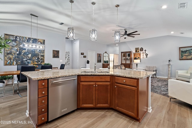 271 Roaring Brook Dr, Saint Augustine, FL 32084 - kitchen featuring dishwasher, open floor plan, vaulted ceiling, a sink, and light wood-type flooring